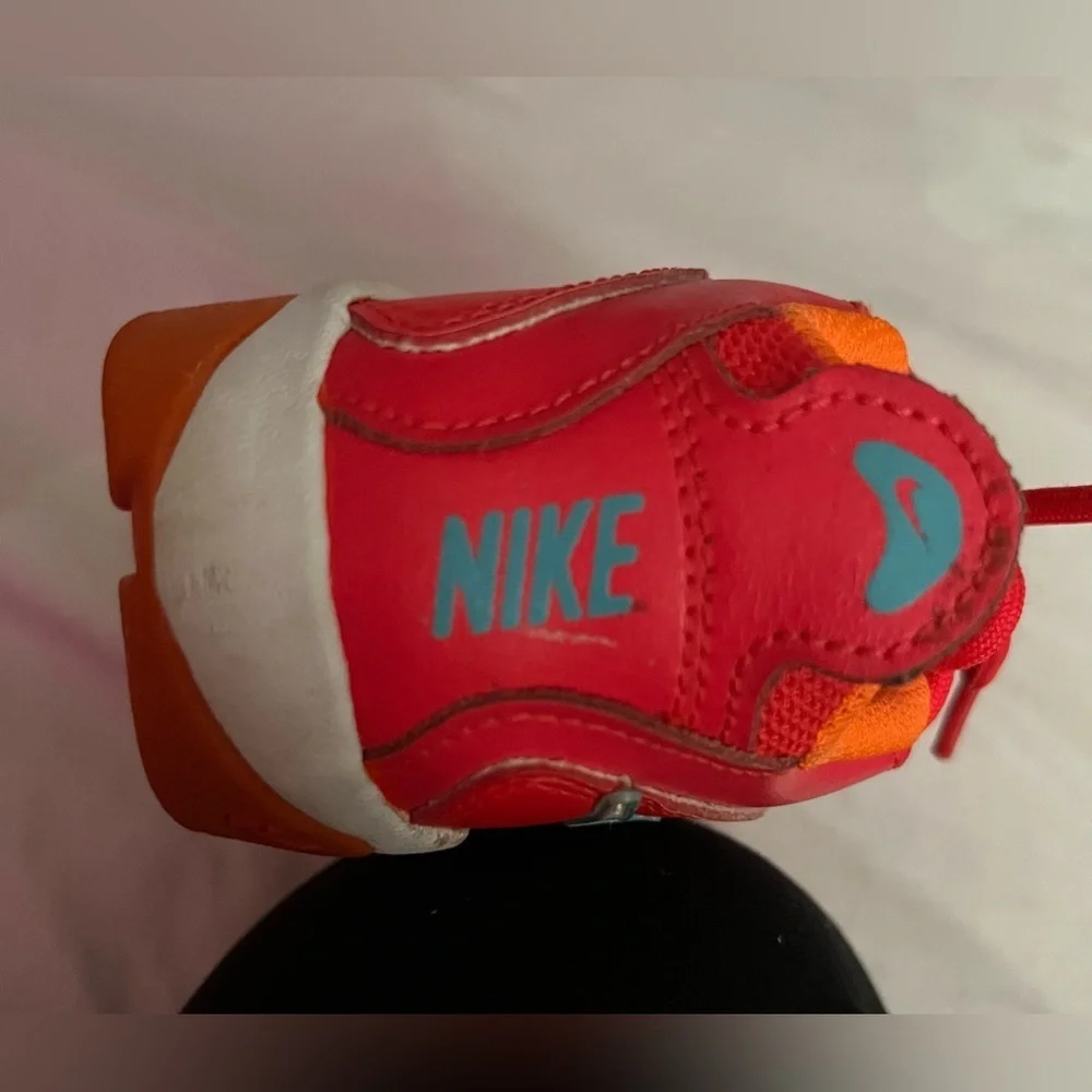 Nike Kids bright red and orange Sneakers